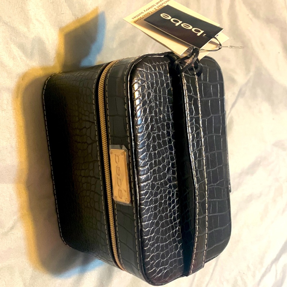 Bebe square makeup box. 2 1.6oz 50 ml travel toiletry bottles.